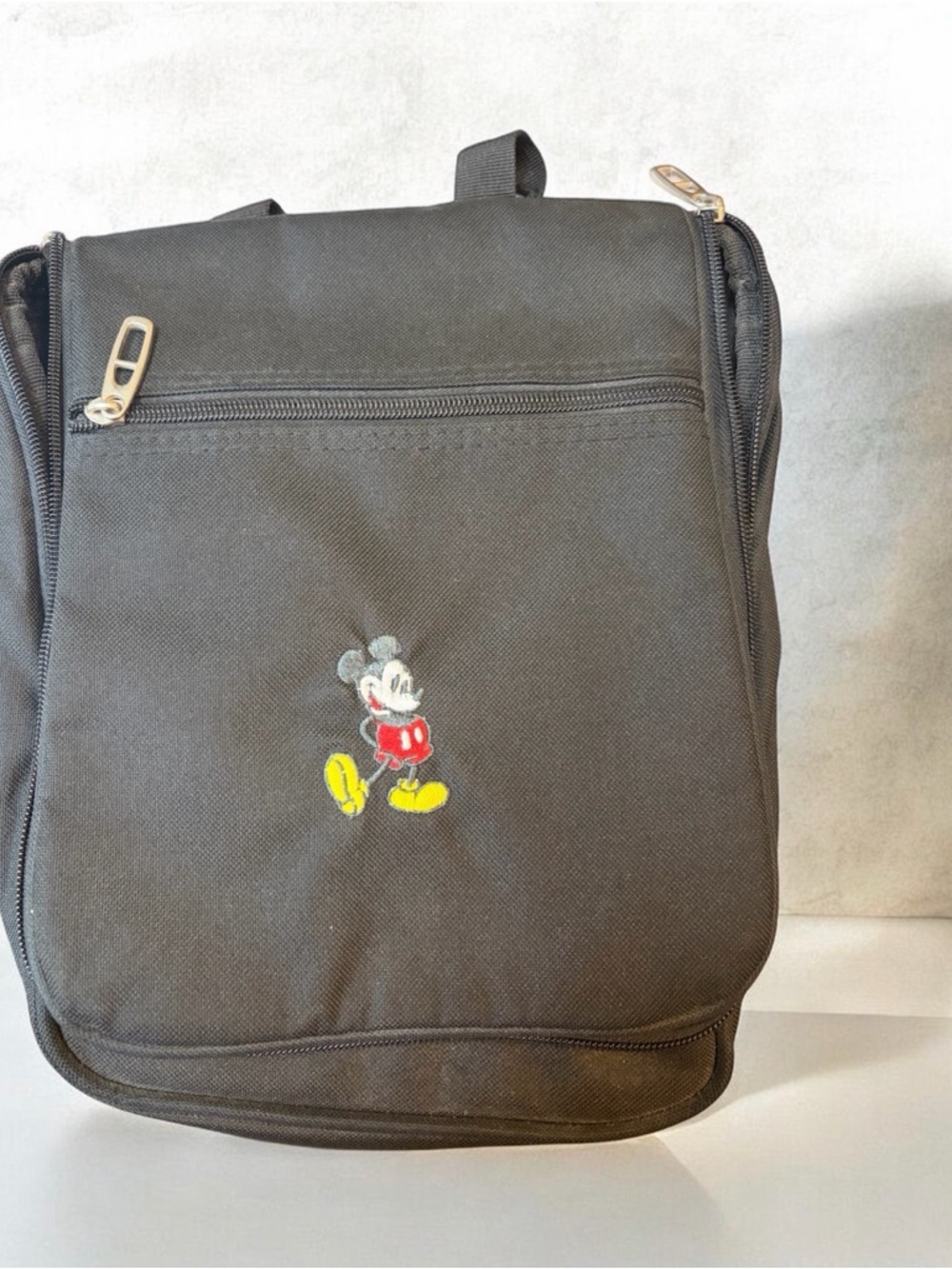 Black Micky Mouse travel bag with Embroidered Mickey Design black hanging